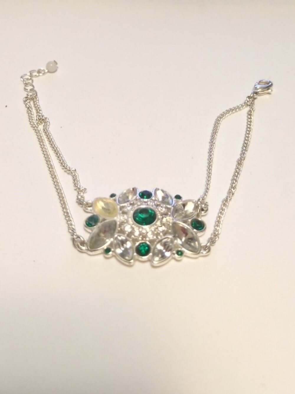 Vintage Avon Green Stone Emerald and Rhinestone Silver Bracelet Yellowing Under